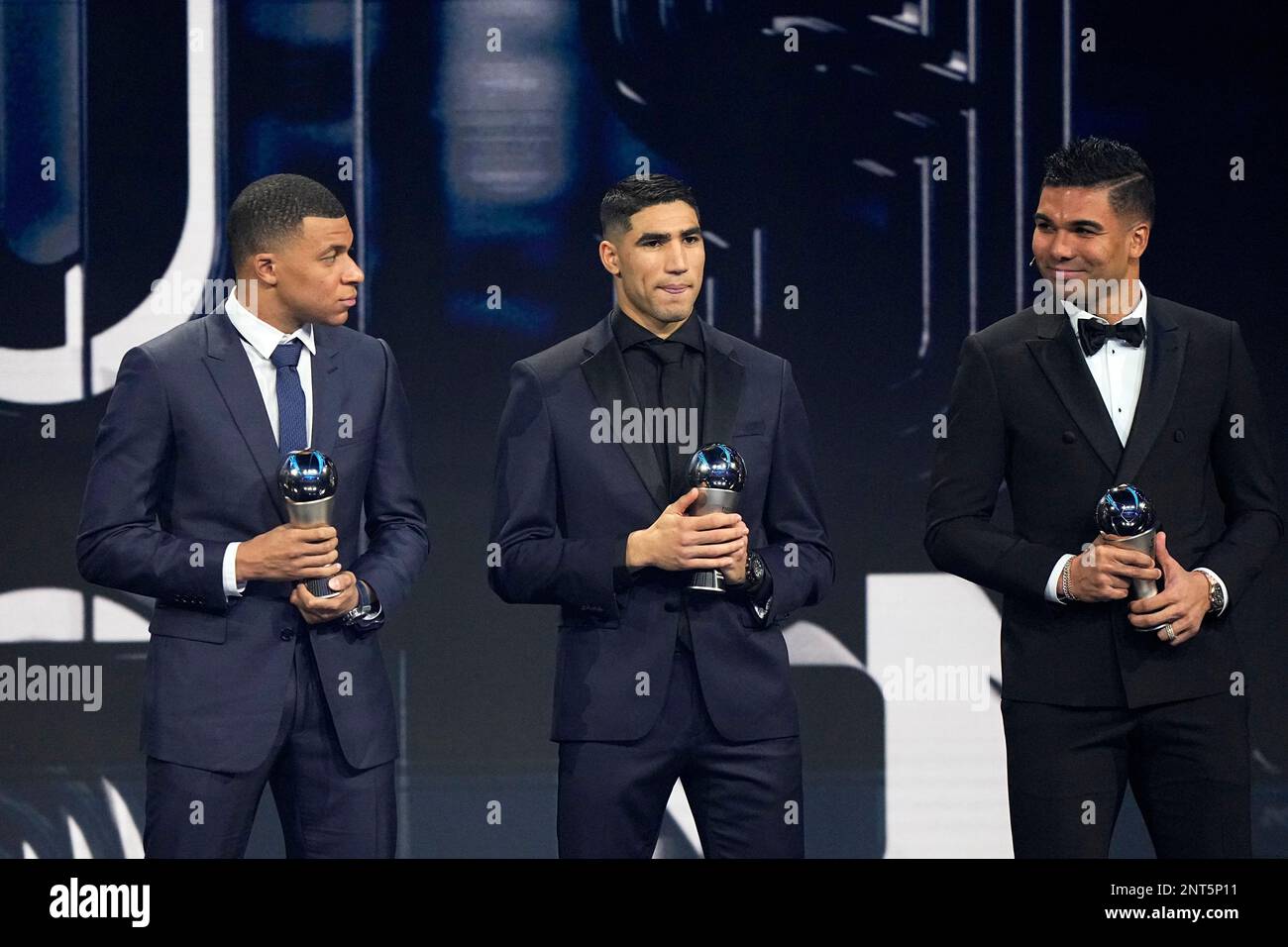 Kylian Mbappe, left, Achraf Hakimi, center and Casemiro pose with