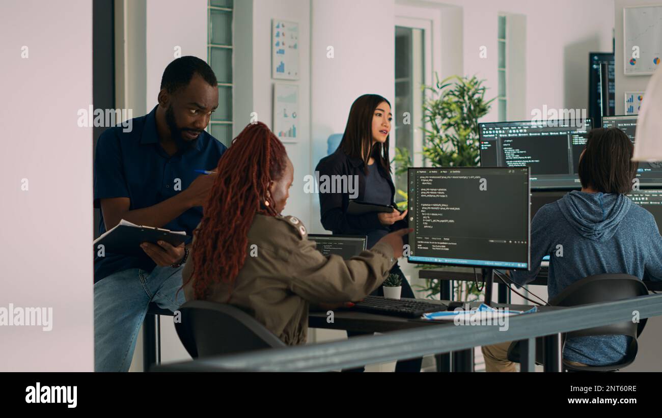African american team of cloud programers talking about programming ...
