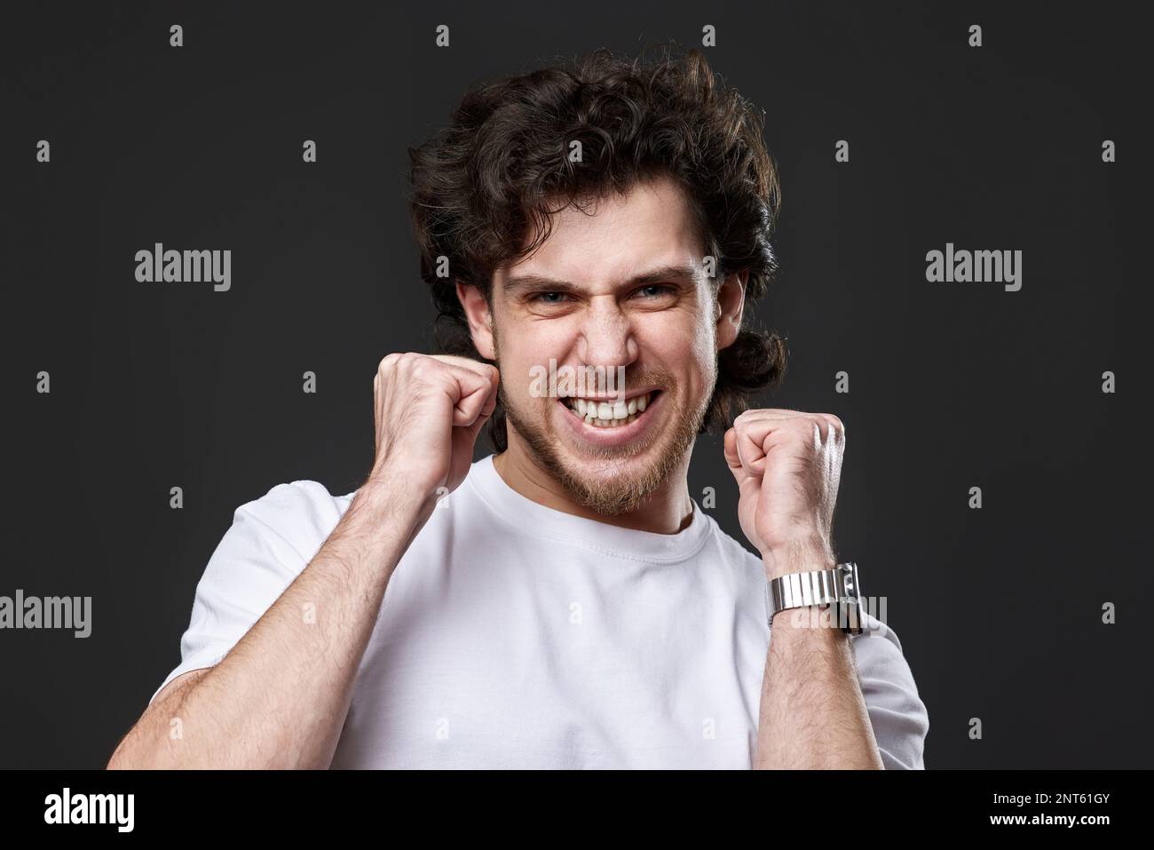 Excited young man celebrating hi-res stock photography and images - Alamy