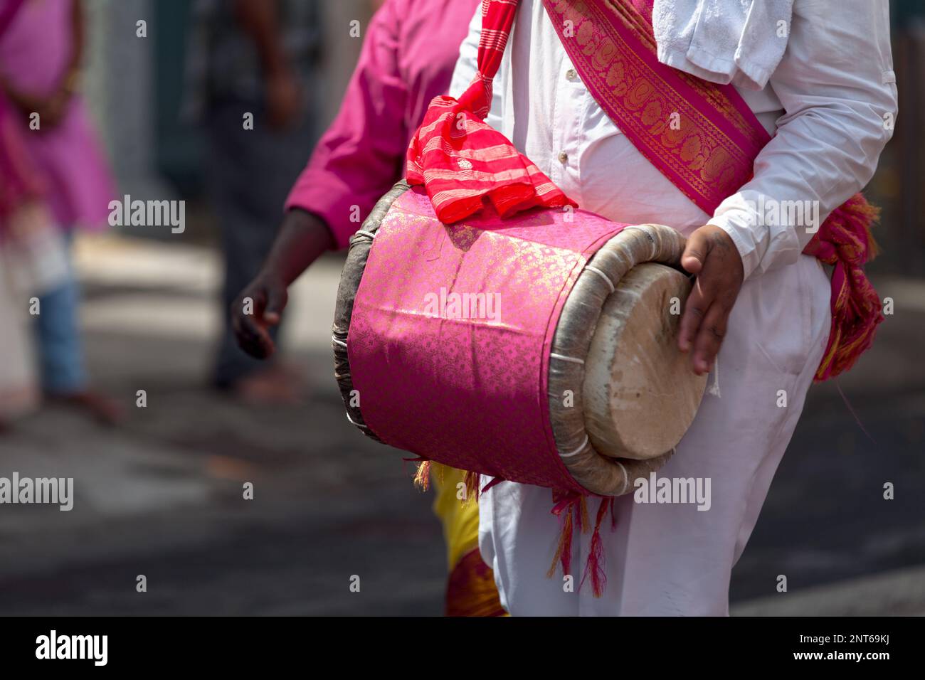Close-up on a Musician playing with a dholak during a Tamil festival. Stock Photo