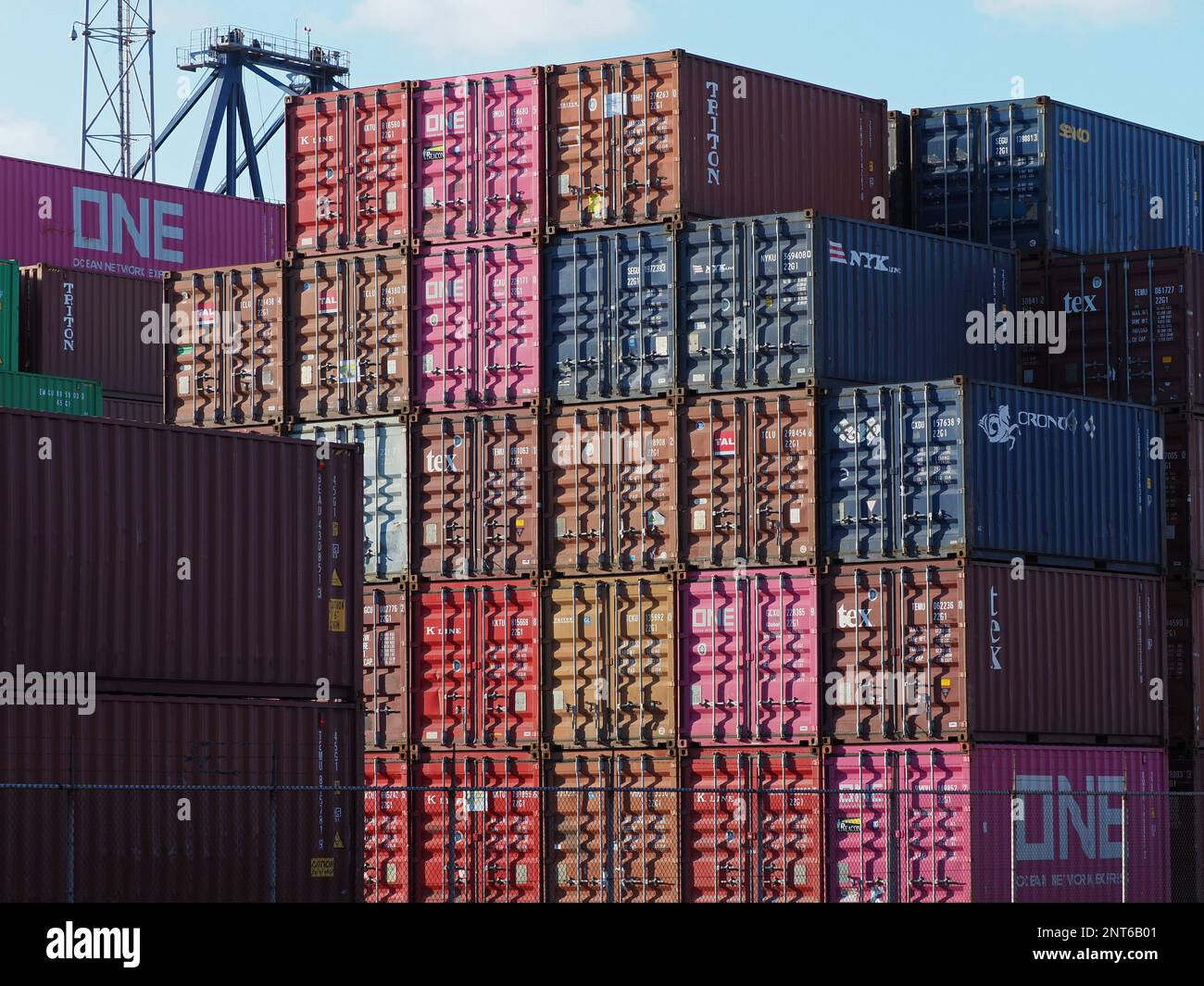 Colourful pattern of stacked shipping container doors in the Port of