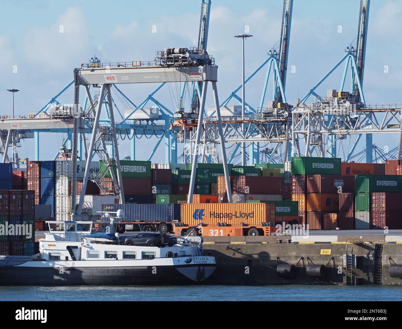 The modern ECT container terminal in the Port of Rotterdam, the Netherlands, is using unmanned cranes and driverless vehicles. Stock Photo