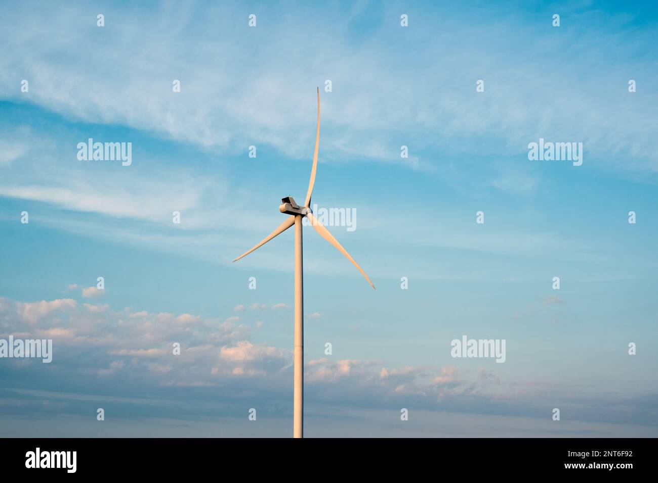 Wind turbine under the blue sky Stock Photo - Alamy