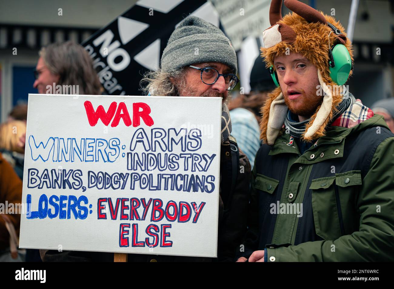 Father and Son holding a sign at the Stop The War protest in London Stock Photo