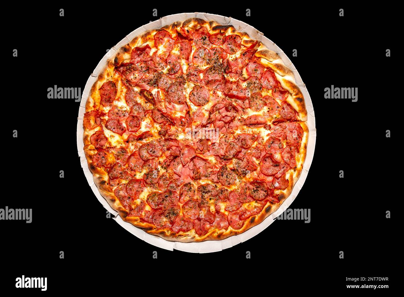 The most traditional pepperoni pizza isolated on a black background. Calabresa pizza Stock Photo