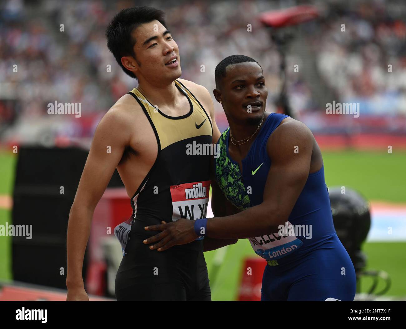 Wenjun Xie (CHN) and Omar McLeod (JAM) embrace after the 110m hurdles ...