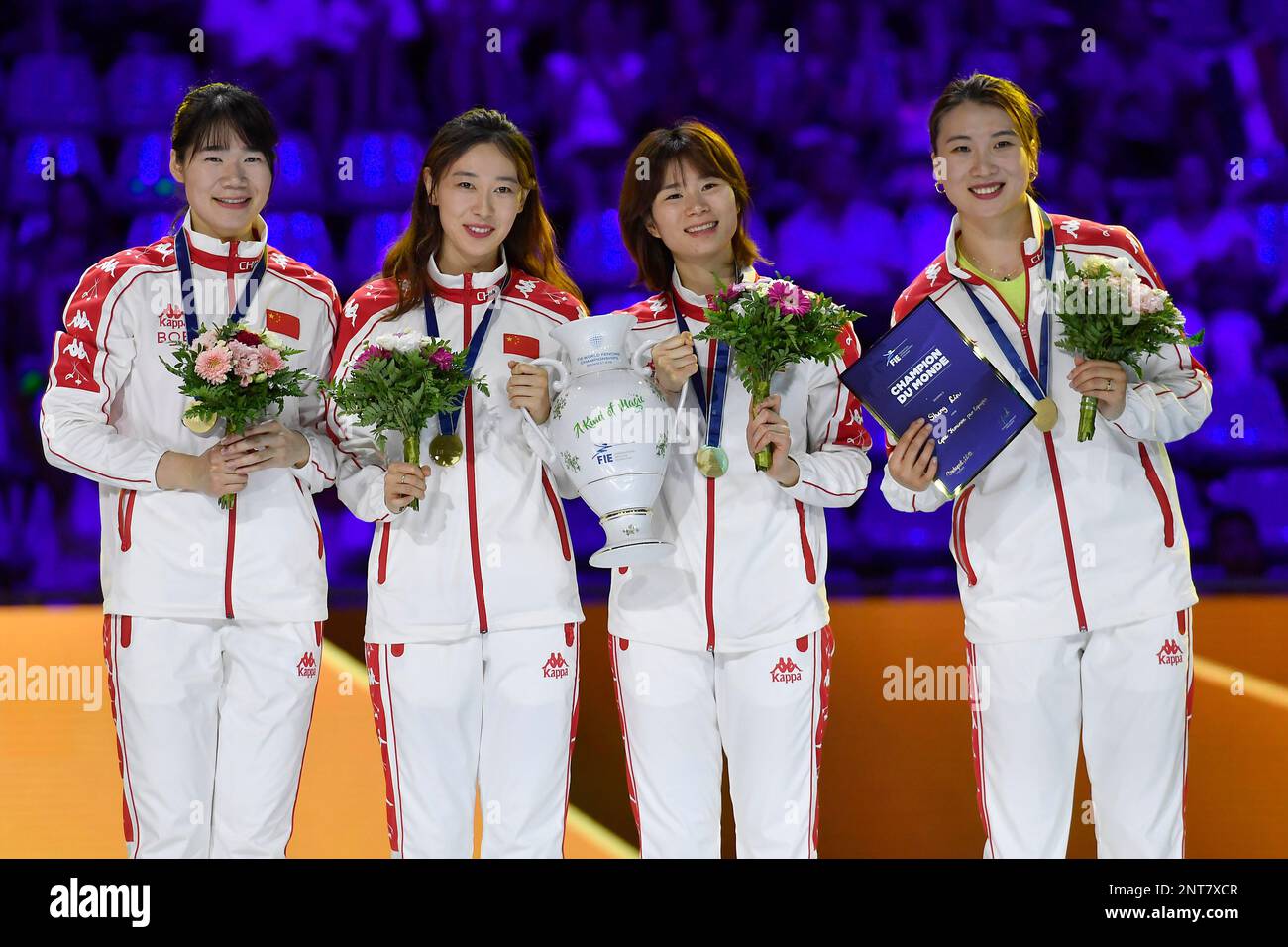 The gold medalist Chinese women's epee team poses during the medal
