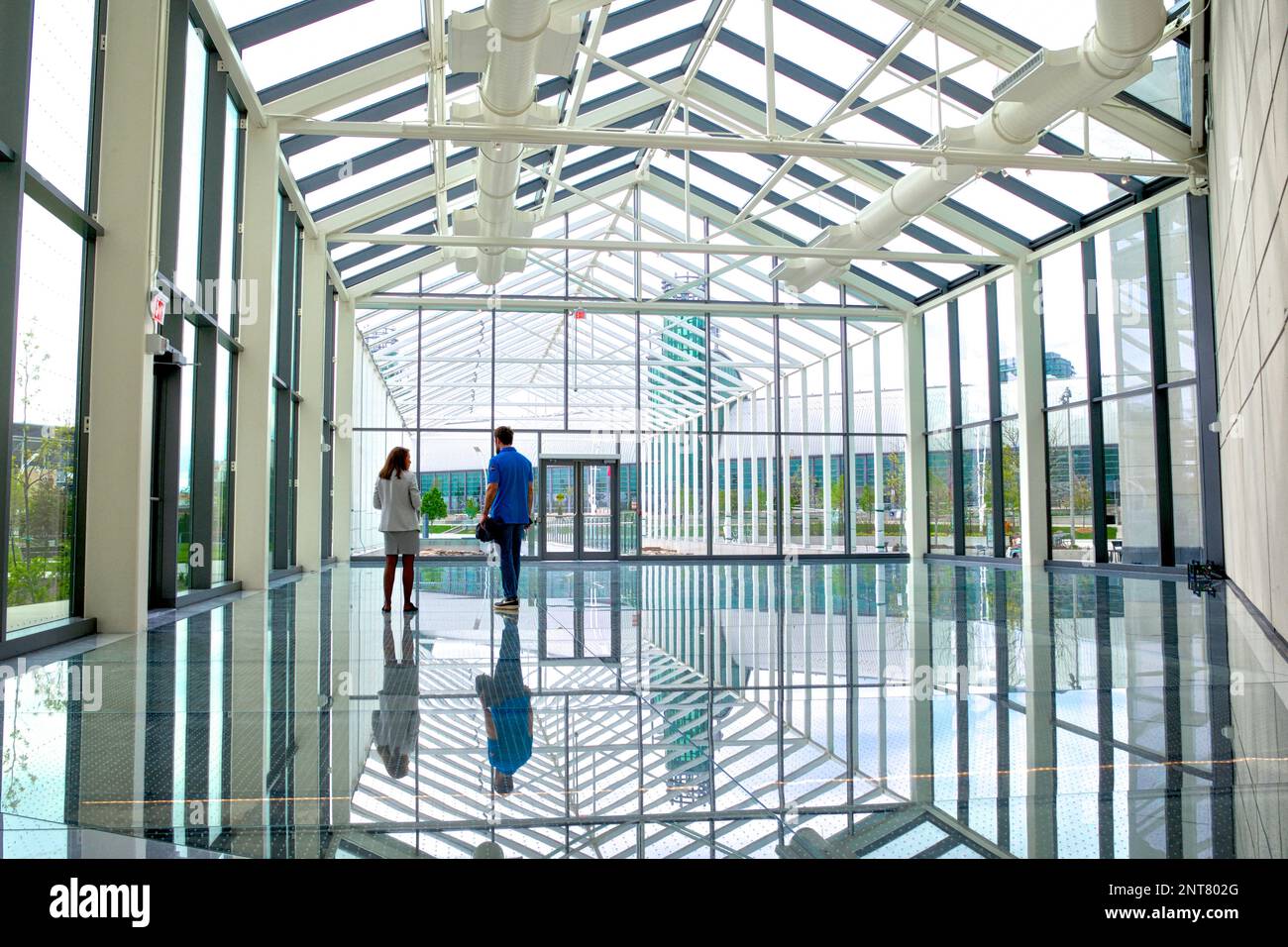 Reflection of the glass dome with the rear view of a couple Stock Photo