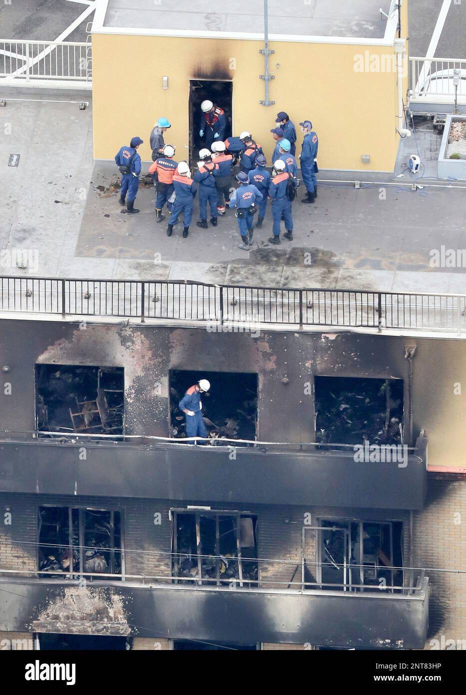 An aerial photo shows officials conduct an investigation at the arson site  of Kyoto Animation Co., Ltd. (so-called Kyoani) in Kyoto on July 20, 2019,  two days after the case. On the