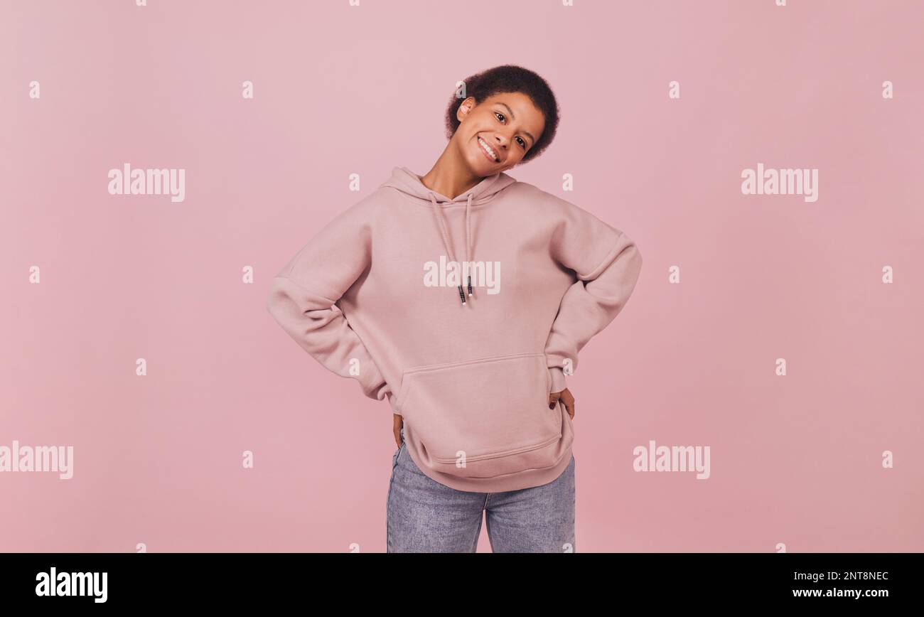 Woman in 'Love Pink' hoodie carries child wearing pink cagoule in Edinburgh  Scotland Stock Photo - Alamy