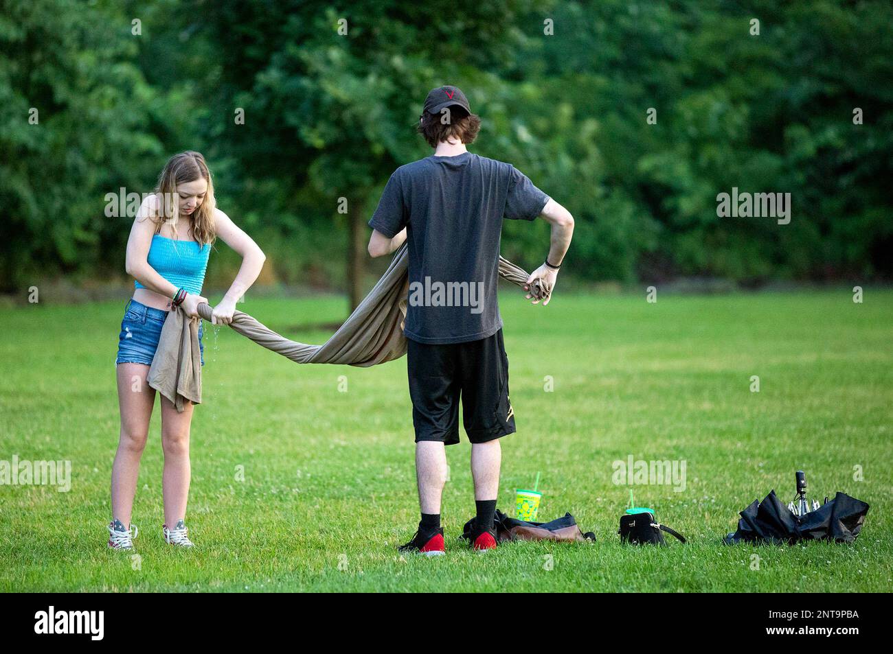 Elaina Bryce, left, and Jake Peters, of Bethel Park, Pa., wring out