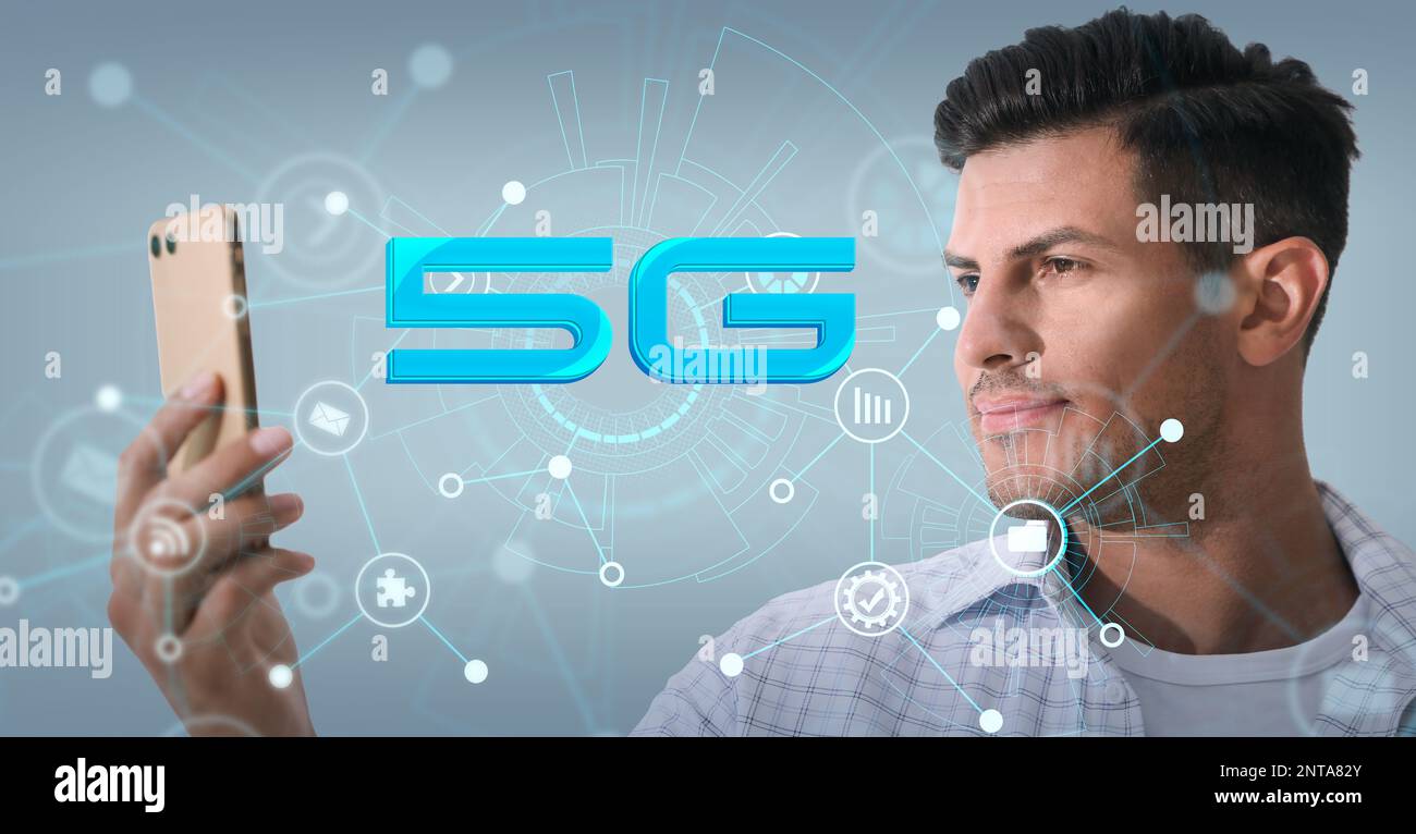 Man using smartphone with 5G network system against light blue background. Banner design Stock Photo
