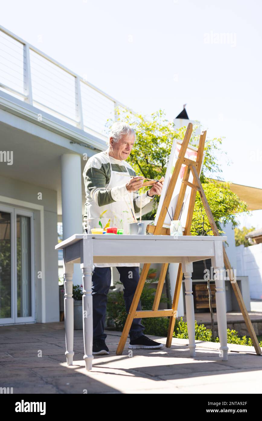 Man painting at easel hi-res stock photography and images - Alamy