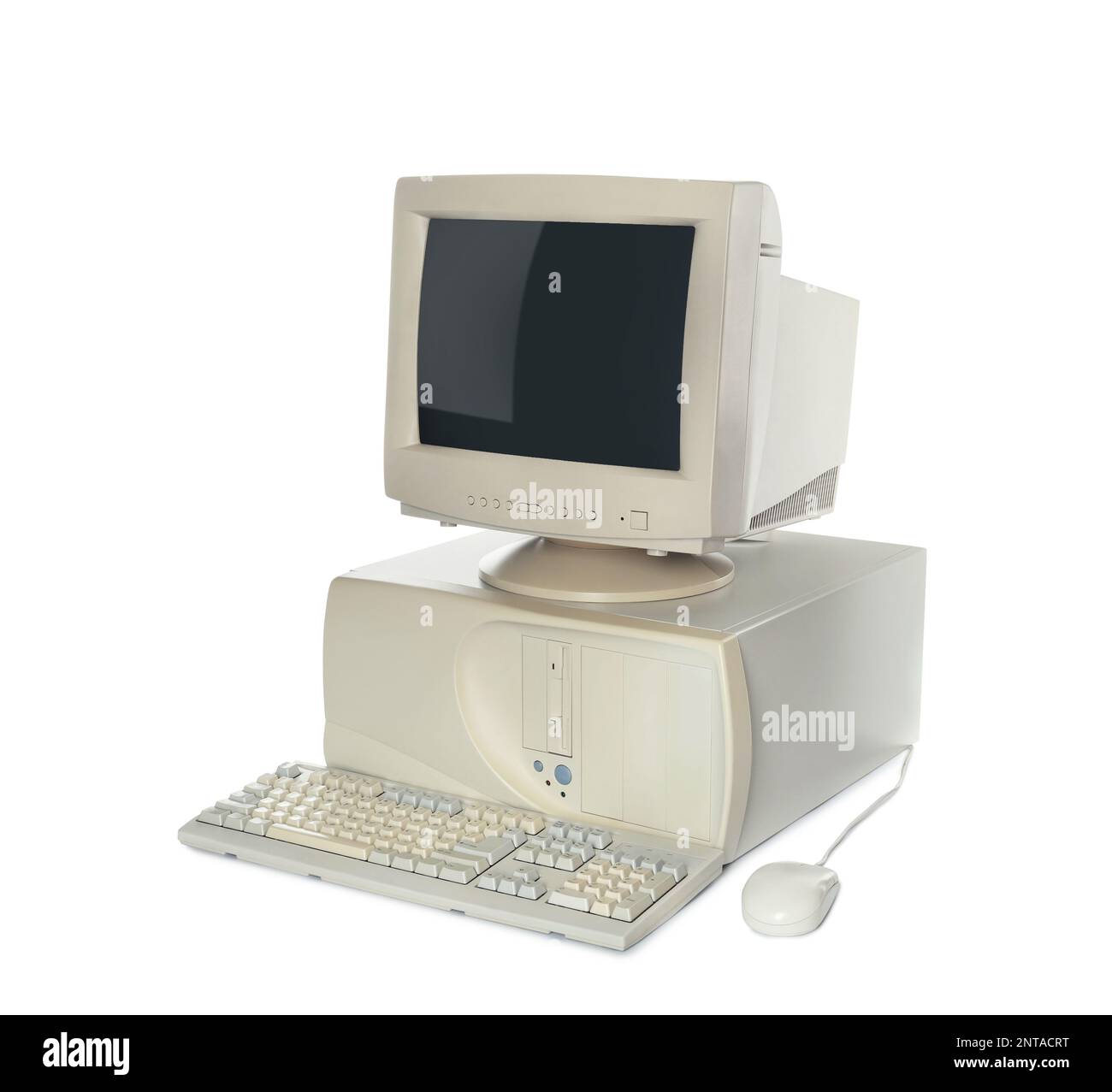 Old computer monitor, keyboard, system unit and mouse on white