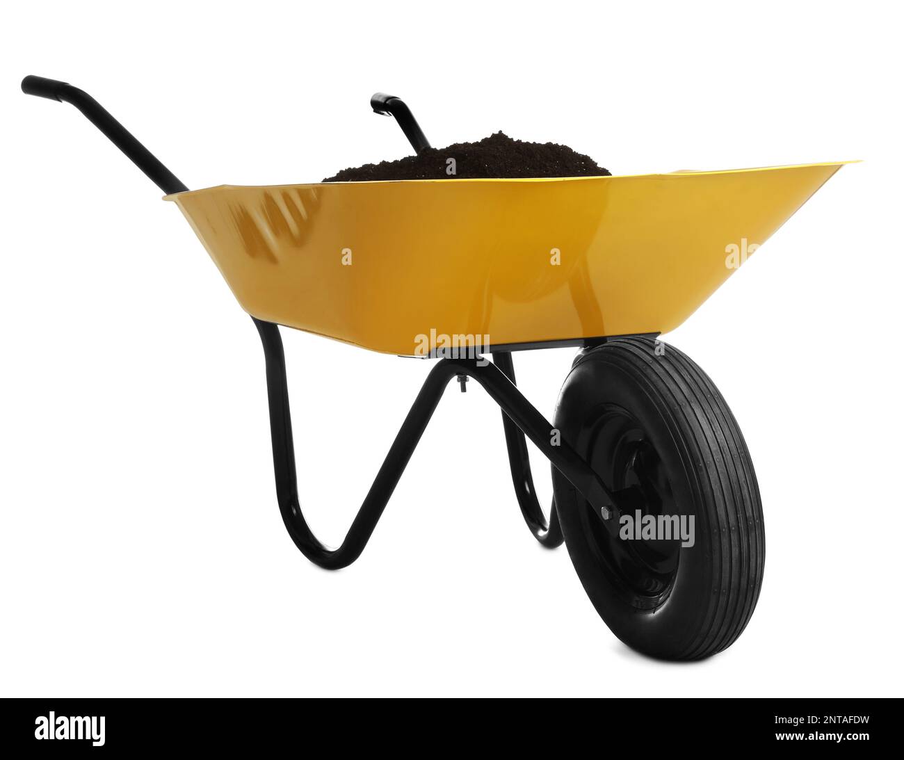Yellow wheelbarrow with soil isolated on white. Gardening tool Stock