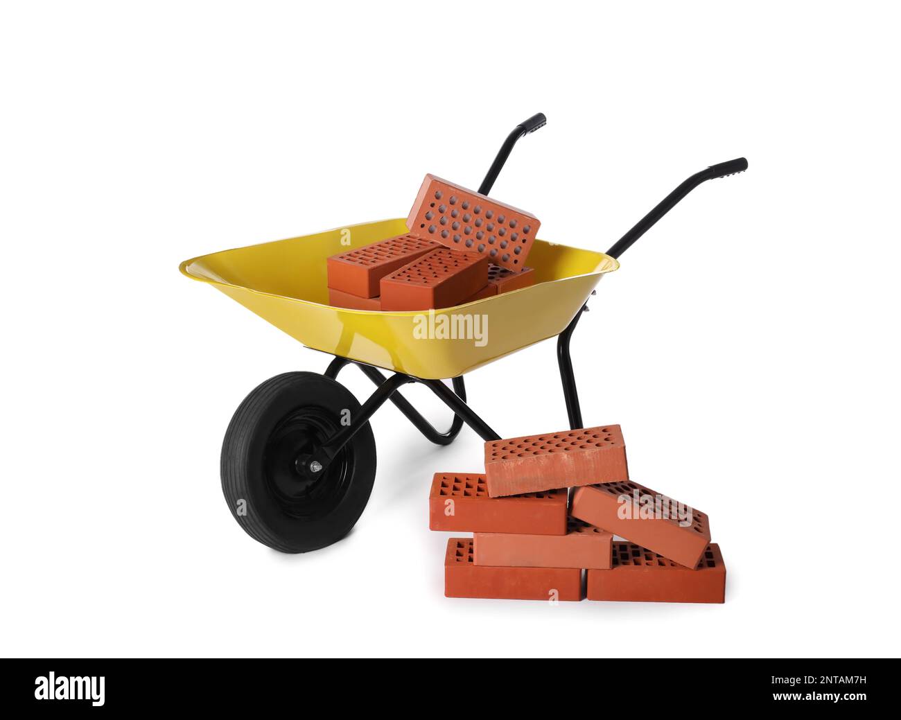 Many red bricks with wheelbarrow on white background Stock Photo