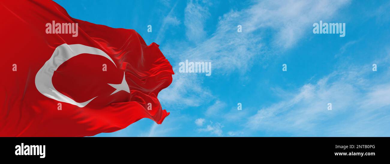 official flag of Turkey Turkey at cloudy sky background on sunset, panoramic view. Turkish travel and patriot concept. copy space for wide banner. 3d Stock Photo
