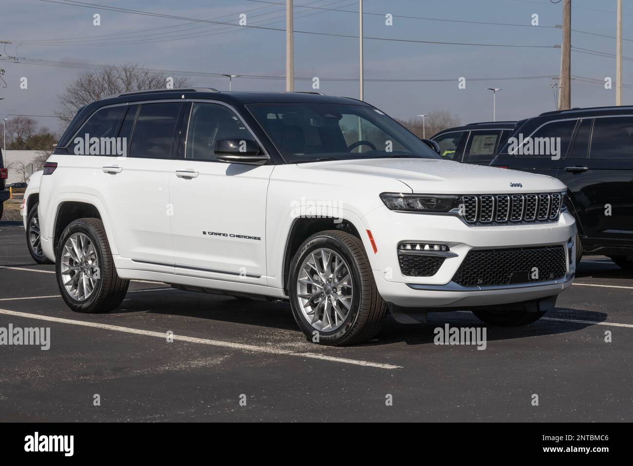 Noblesville - Circa February 2023: Jeep Grand Cherokee display at a dealership. Jeep offers the Grand Cherokee in Laredo, Limited, and Trailhawk model Stock Photo