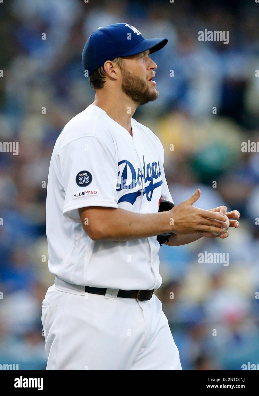 Los Angeles Dodgers starting pitcher Clayton Kershaw (22) reacts