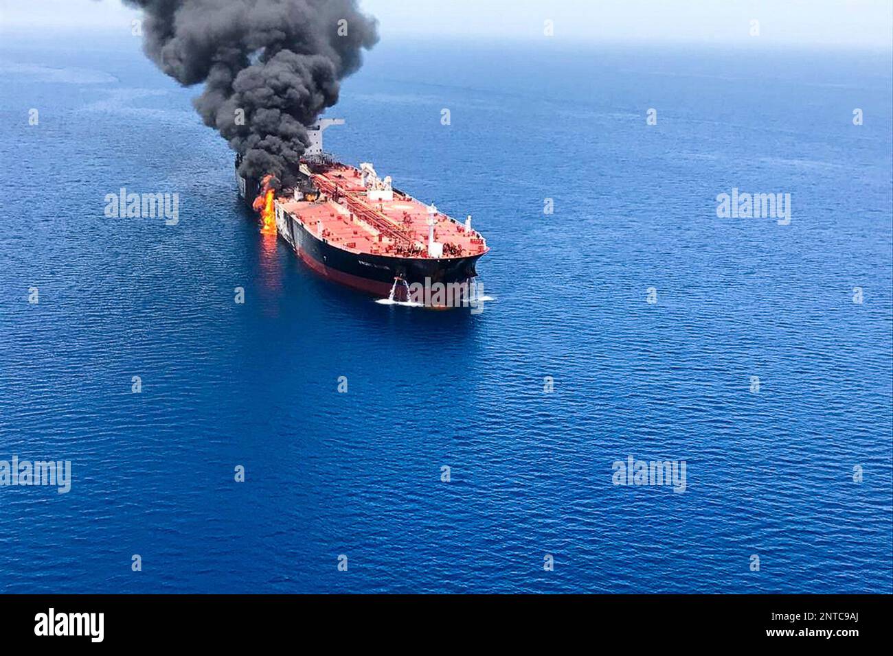 An oil tanker is on fire in the sea of Oman, Thursday, June 13, 2019. Two oil tankers near the strategic Strait of Hormuz were reportedly attacked on Thursday, an assault that left one ablaze and adrift as sailors were evacuated from both vessels and the U.S. Navy rushed to assist amid heightened tensions between Washington and Tehran. (AP Photo/ISNA) Stock Photo