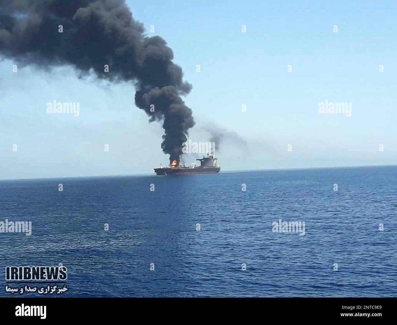 In this photo released by state-run IRIB News Agency, an oil tanker is on fire in the sea of Oman, Thursday, June 13, 2019. Two oil tankers near the strategic Strait of Hormuz have been reportedly attacked. The alleged assault on Thursday left one ablaze and adrift as sailors were evacuated from both vessels. The U.S. Navy rushed to assist amid heightened tensions between Washington and Tehran. (IRIB News Agency via AP) Stock Photo