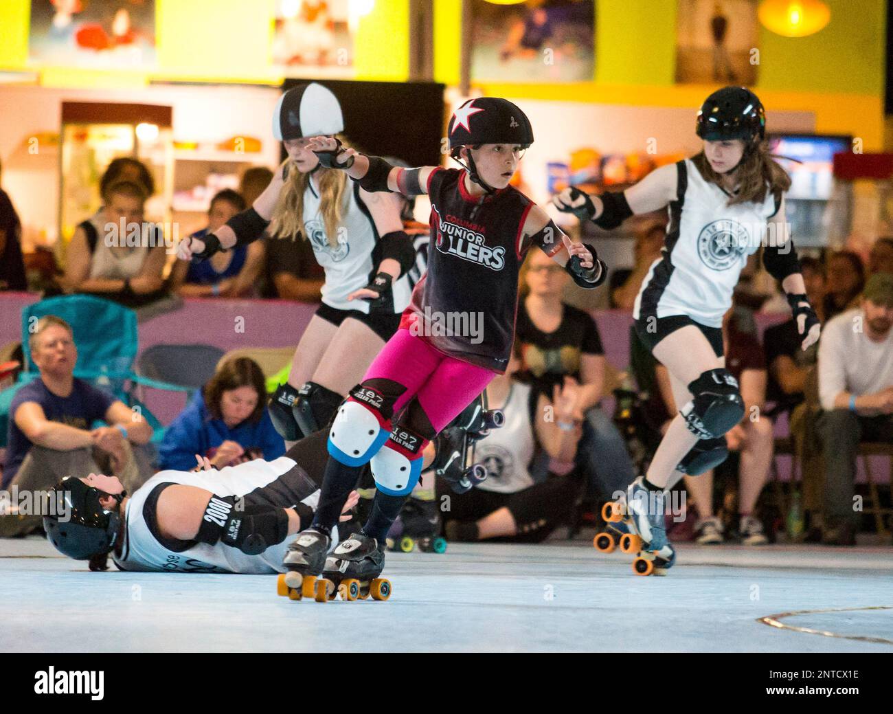 The IC Bruisers, in white, of Iowa City, Iowa, and Columbia Junior