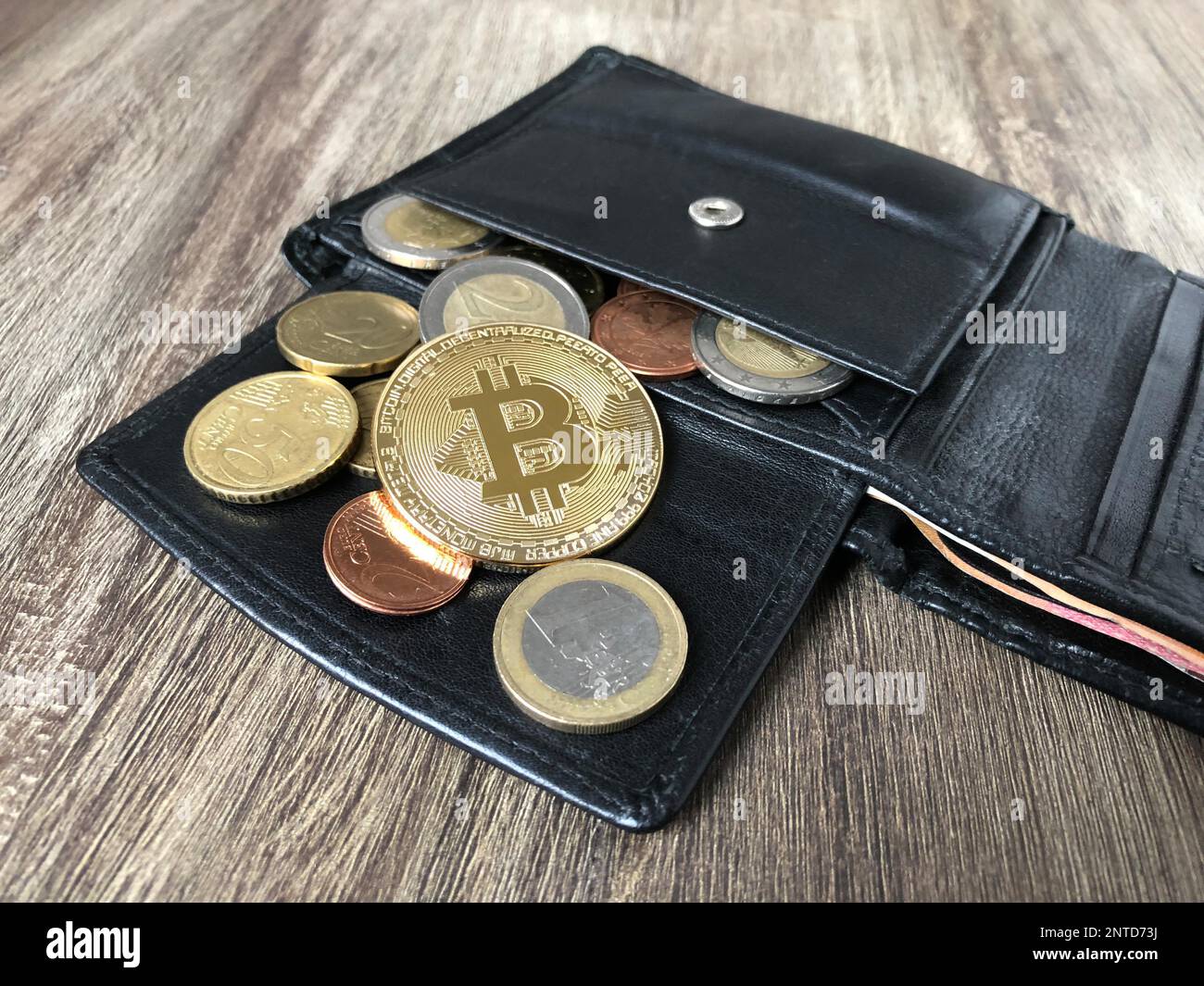 Wallet with bitcoin euro and cent coins Stock Photo - Alamy