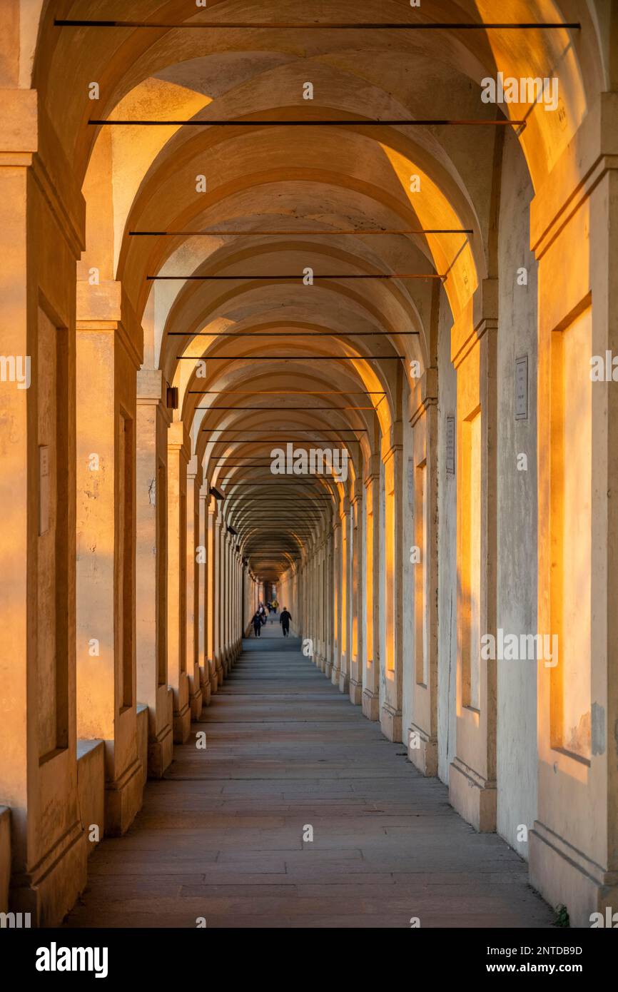Portico at sunset, arcades to Colle della Guardia, longest arcade in the world, Portico di San Luca, Bologna, Emilia-Romagna, Italy Stock Photo