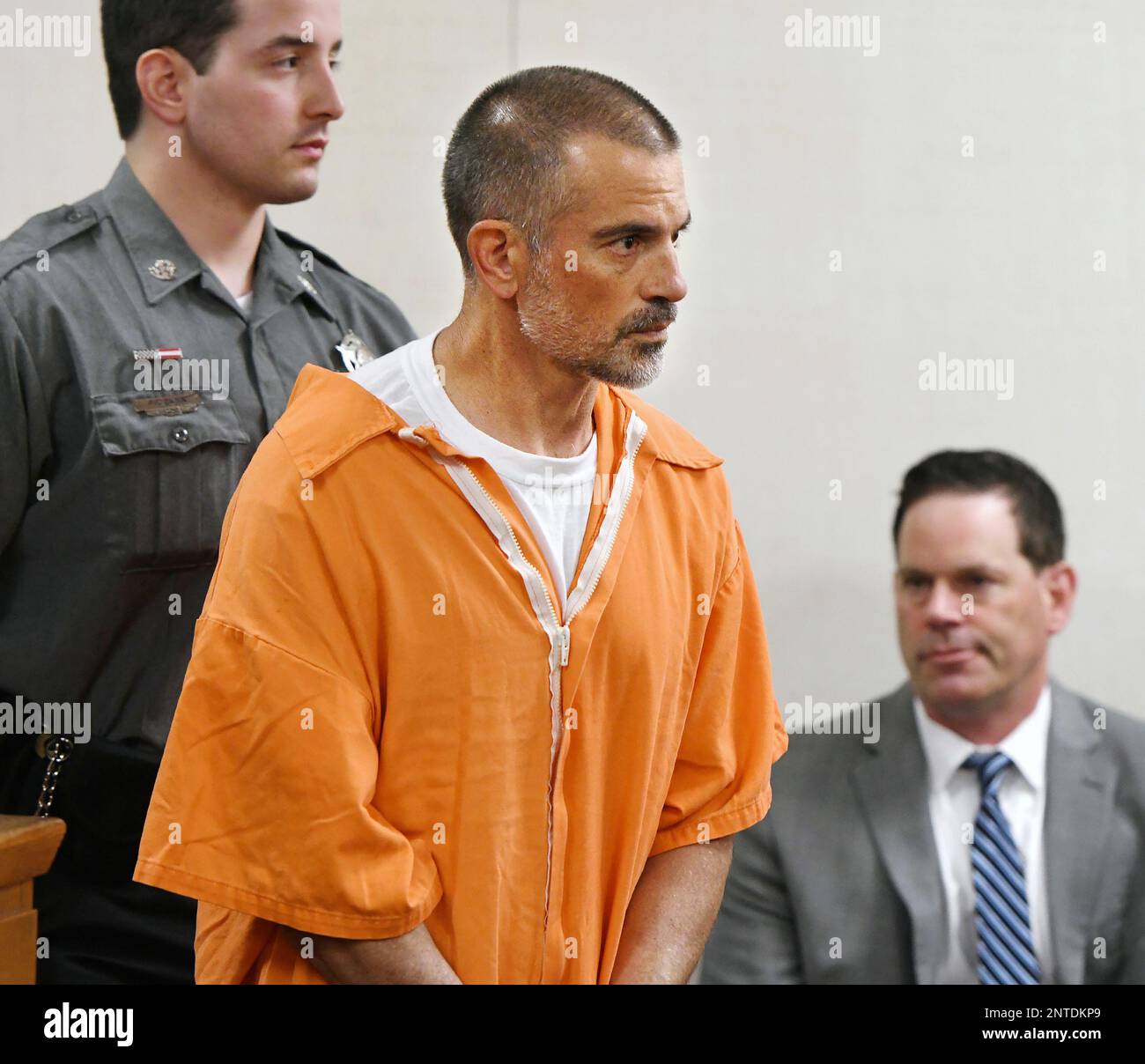 Fotis Dulos, center, is arraigned on charges of tampering with or