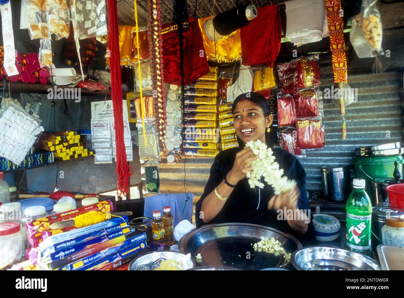 A girl selling Pooja things in Karumadi near Ambalapuzha, Kerala, India, Asia Stock Photo