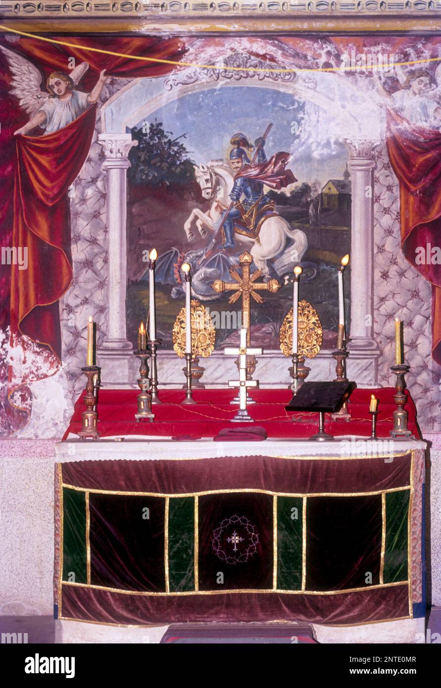 Altar in St. Thomas Church at Niranam St. George kills the dragon. Painting Mural Fresco Stock Photo