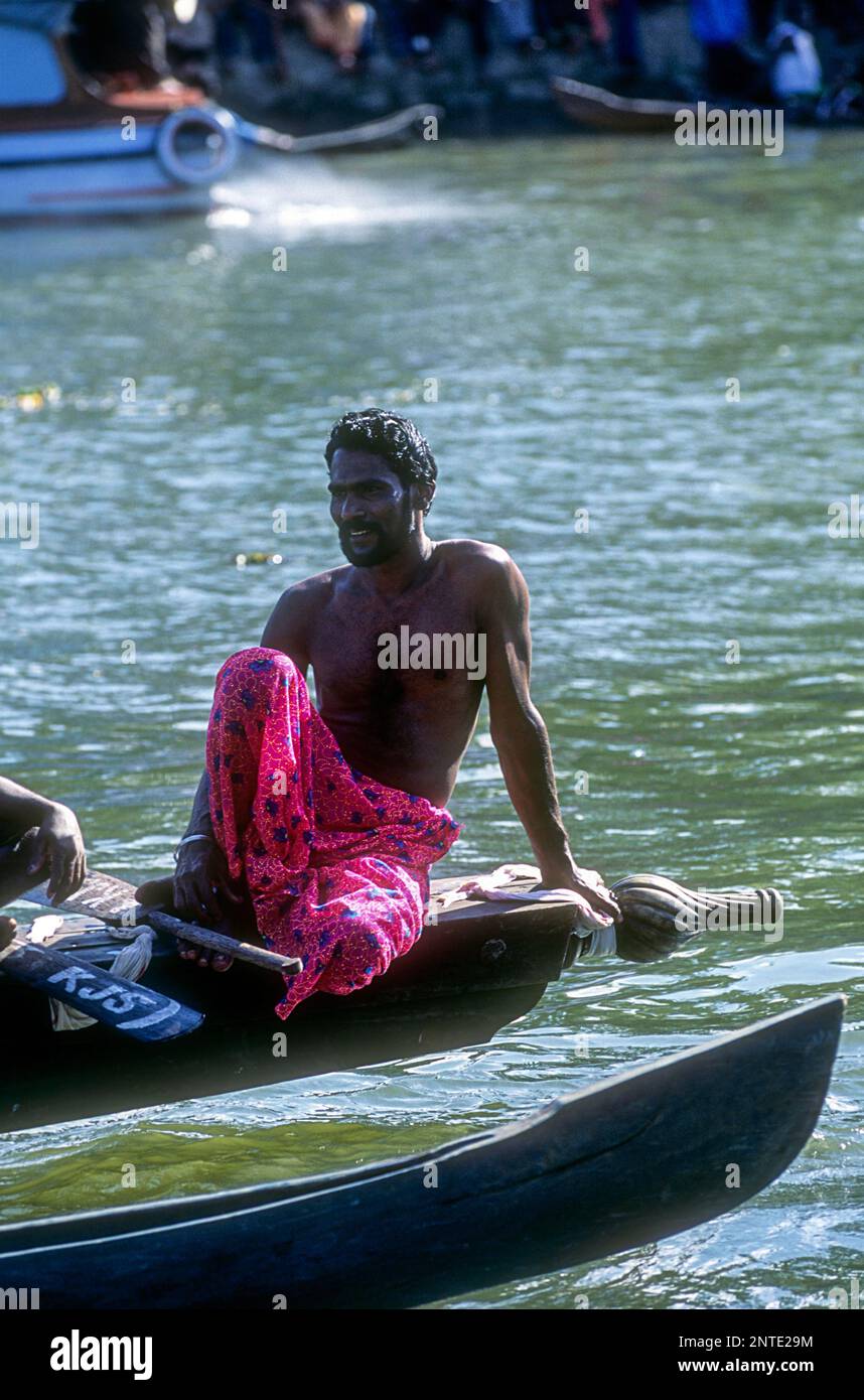 A boat rowing man sitting on the boat at Payipad, Kerala, South India, India, Asia Stock Photo