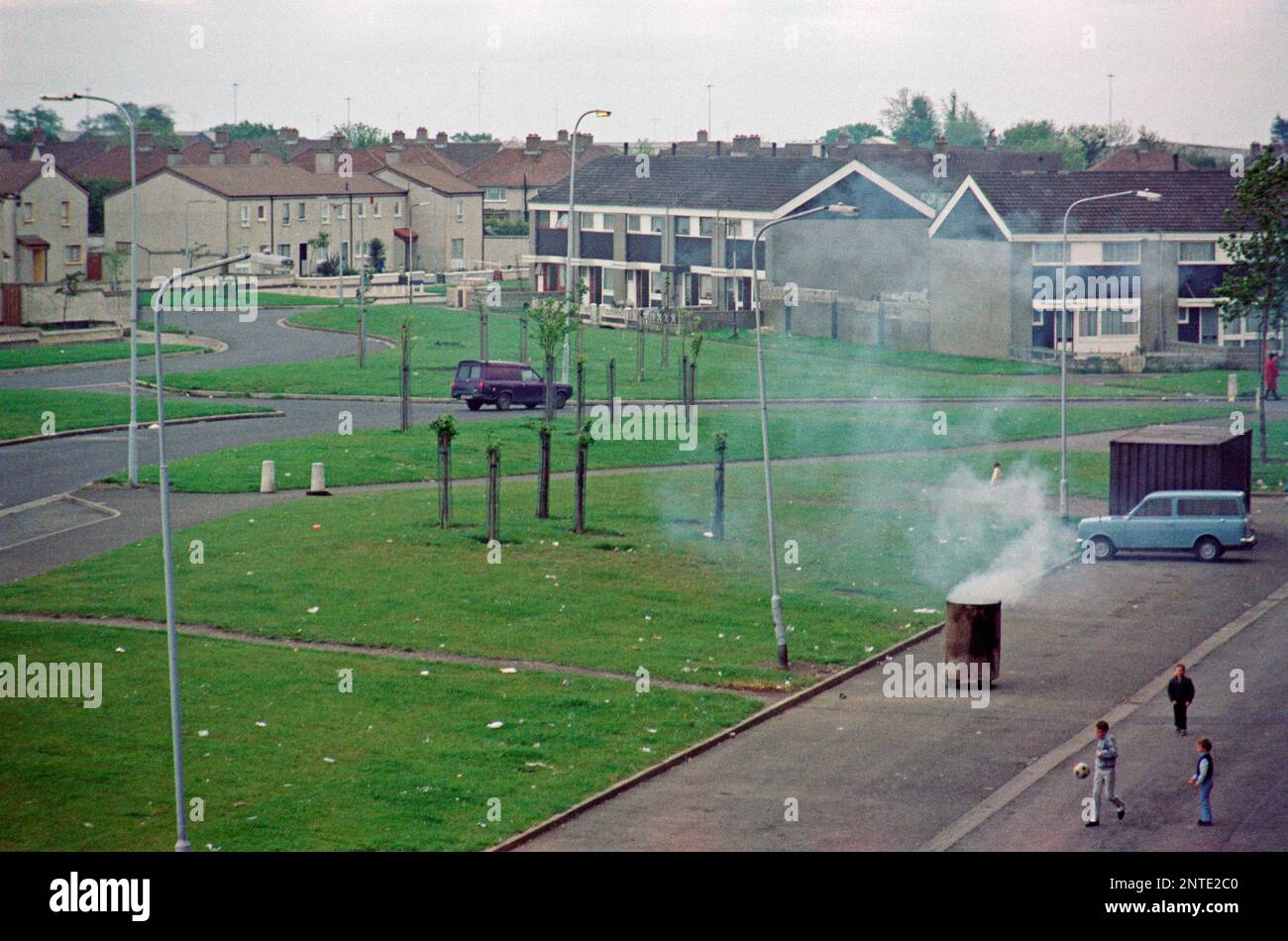 Burning rubbish in a bin, Shangan Road, Houses, Ballymun, Dublin