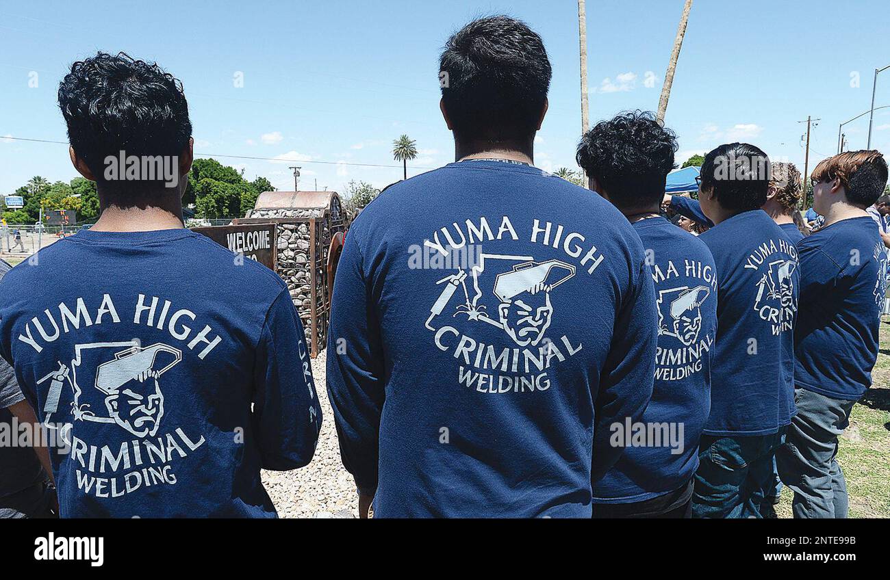 Students studying welding at Yuma High School wear "Criminal Welding