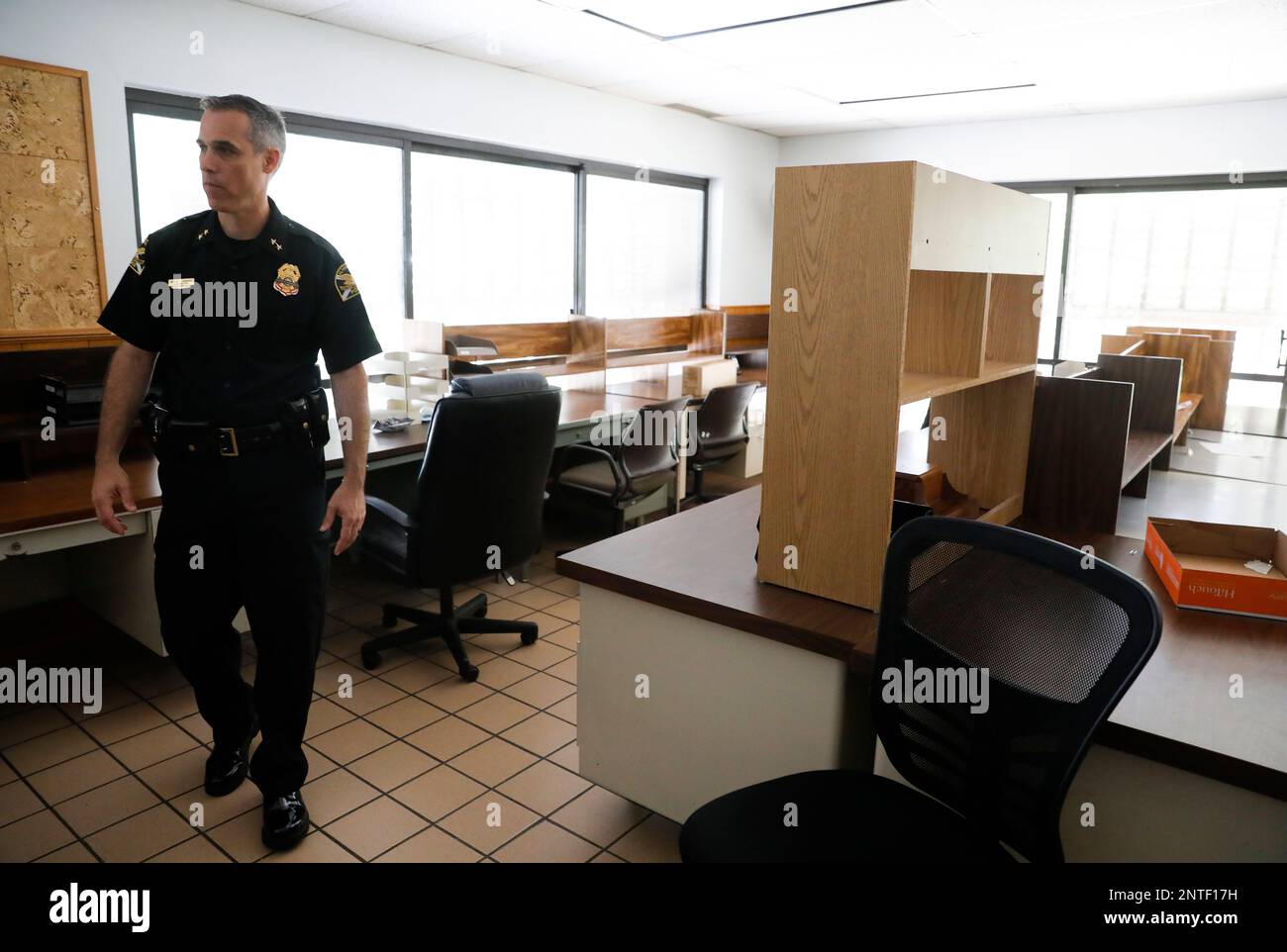 In this Thursday, May 9, 2019 photo, St. Petersburg Police Chief Mike  Kovacsev walks in the area that served as the Uniform Patrol sergeants  office in the old St. Petersburg Police Department