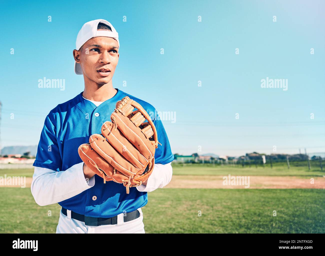 Mockup, baseball and man with glove, fitness and ready for game, confident and focus outdoor. Male athlete, gentleman and player with uniform Stock Photo