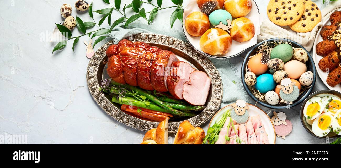 Classic Easter ham dinner. Top view table scene on a white background