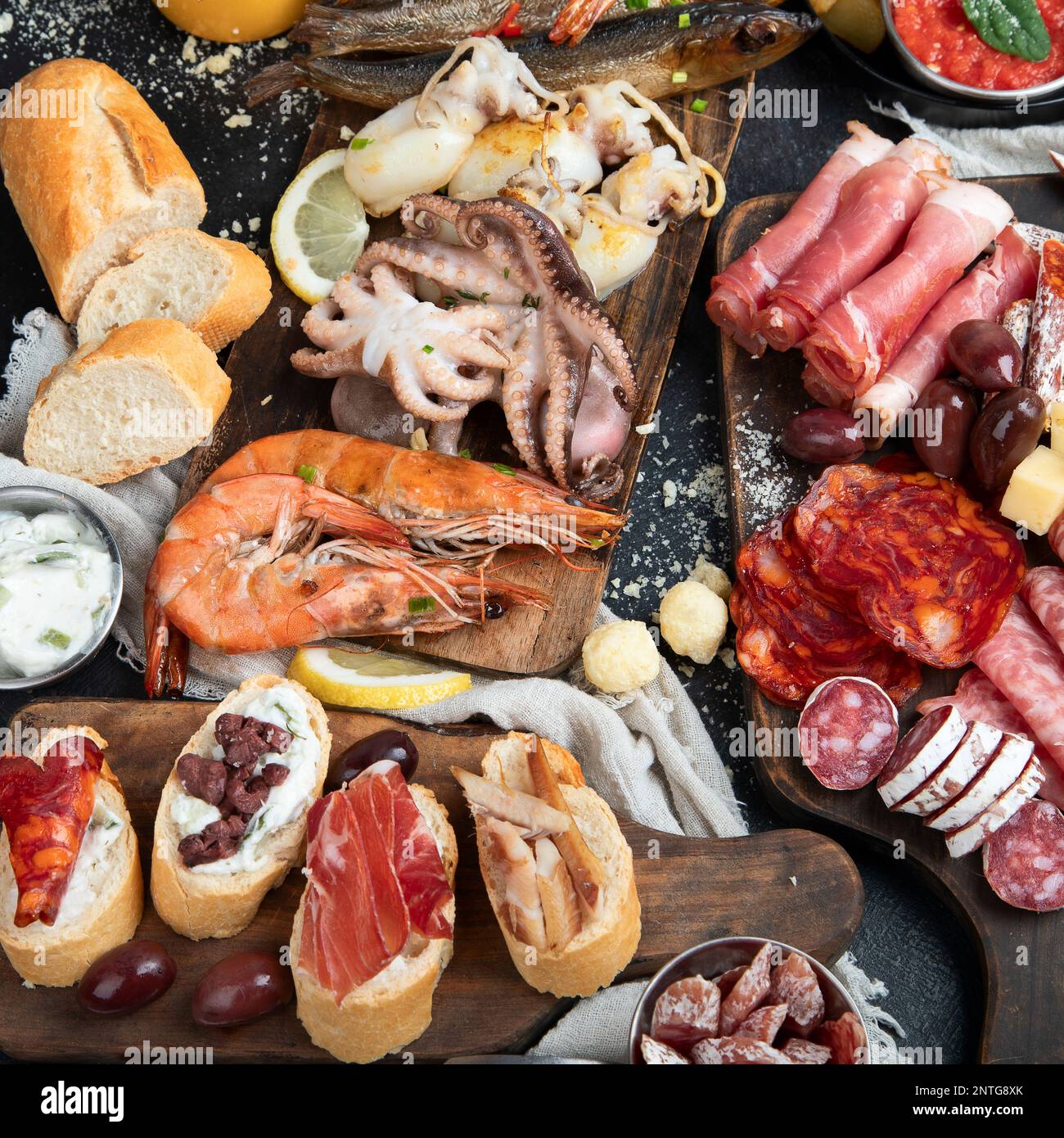 Typical spanish tapas with jamon slices, chorizo, salami, olives