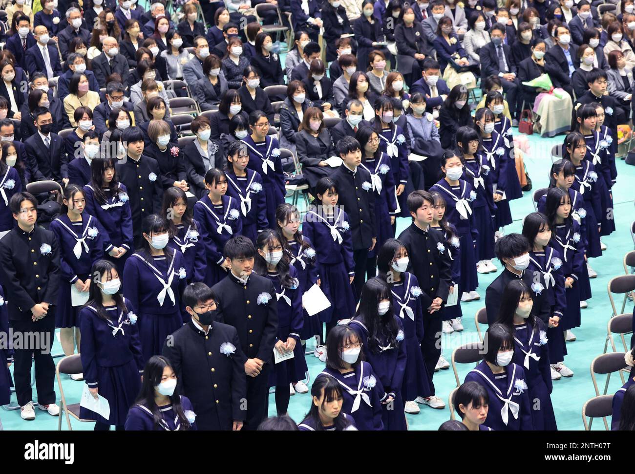 High school students attend the graduation ceremony at Shimizudani