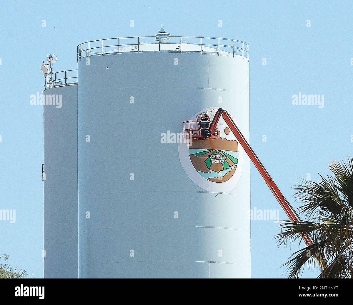 A painter puts the final touches on the Fort Yuma Quechan Indian Tribe