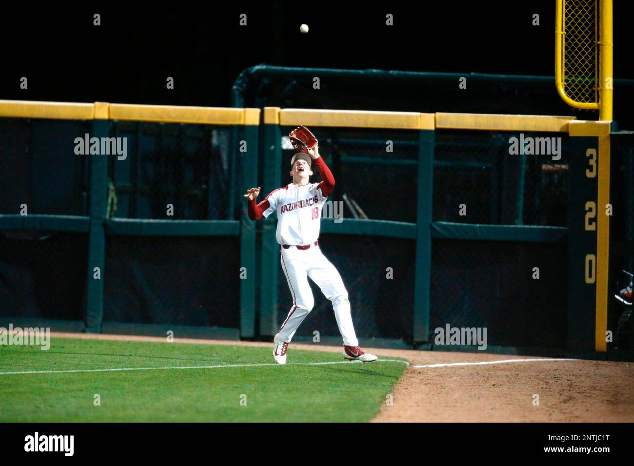 Apr 18, 2019: Arkansas right fielder Heston Kjerstad #18 makes a leg kick  as he is at the plate waiting for the pitch. Arkansas defeated Mississippi  State 5-3 in Fayetteville, AR, Richey