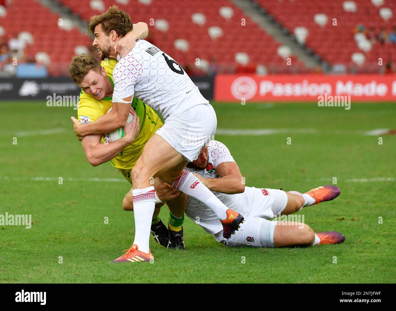England's Tom Mitchell tackles Australia's Henry Hutchison during the ...