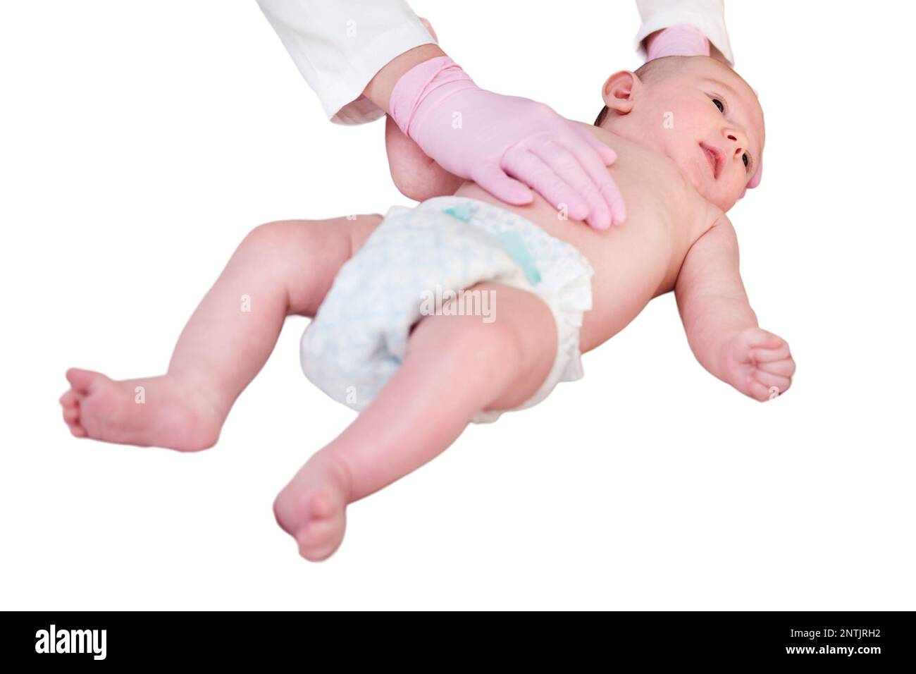 The doctor does gymnastics and massage to a newborn baby, isolated on a white background. Nurse