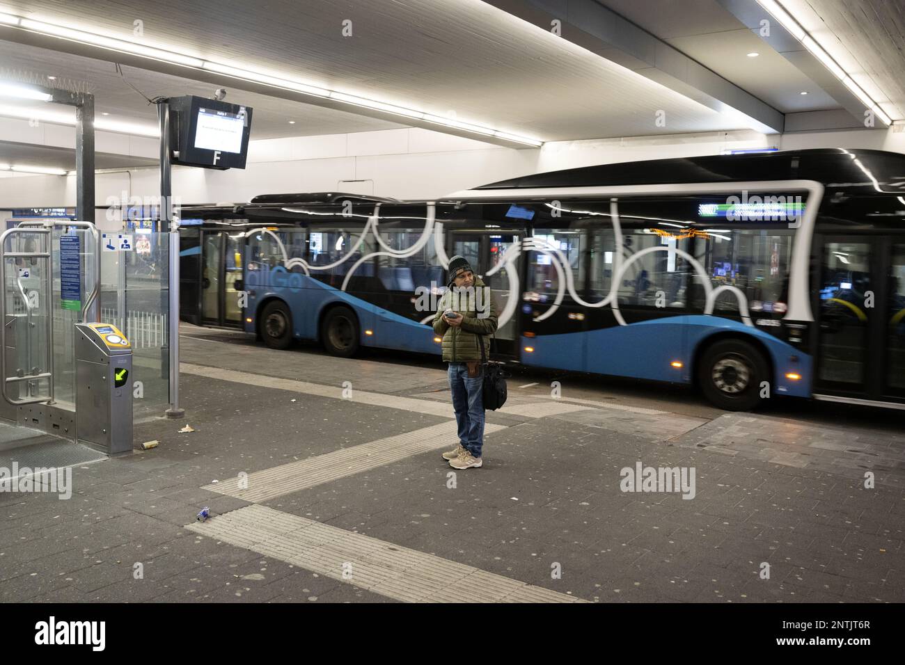 ALMERE Travelers at Central Station. Regional transport staff are on