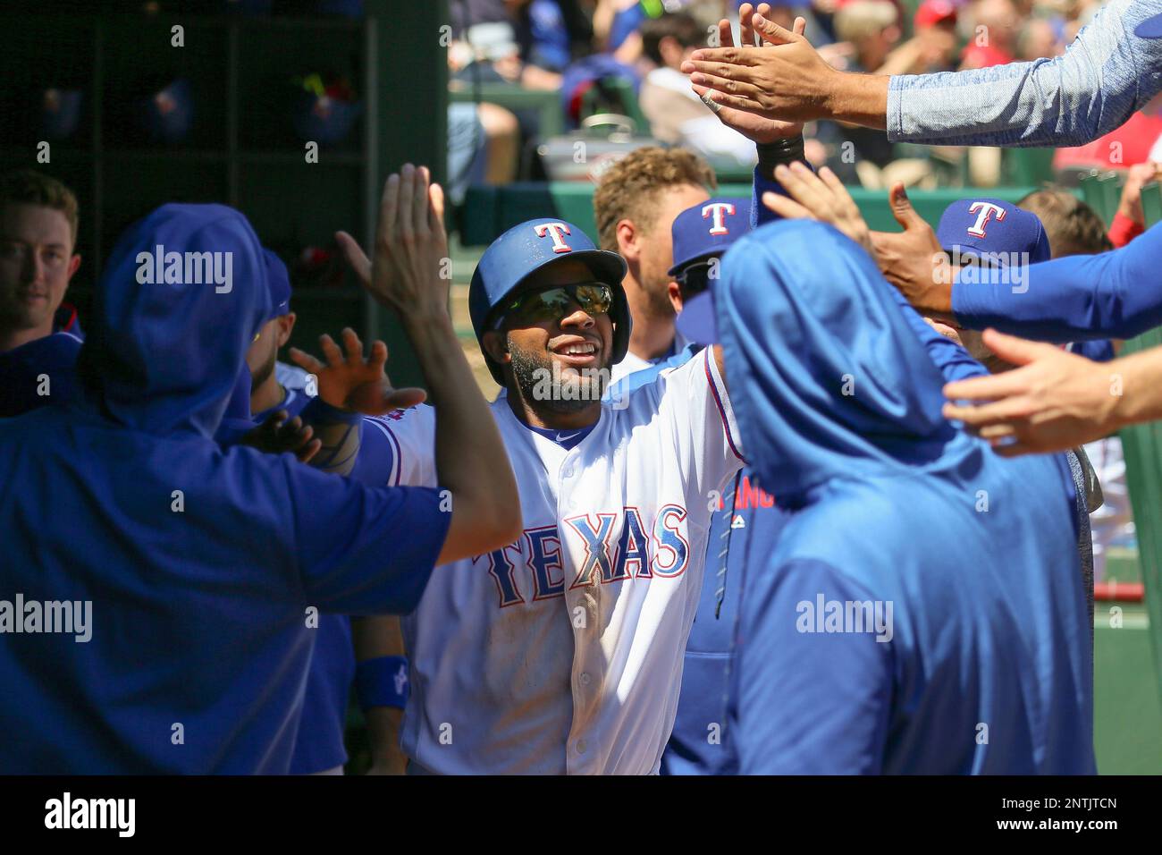 Texas Rangers shortstop Elvis Andrus (1) leaps over Houston Astros L.J. Hoes  (28) after making the throw to first to turn a double play in the second  inning at Globe Life Park