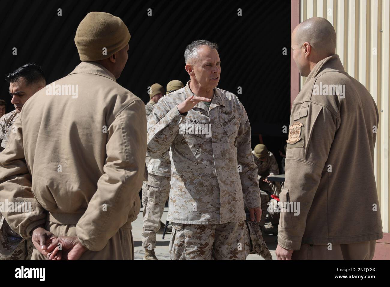 Twentynine Palms, California, USA. 24th Feb, 2023. U.S. Marine Corps Lt. Gen. Matthew Glavy, commanding general, U.S. Marine Forces Cyberspace Command, speaks with Marines assigned to Heavy Marine Helicopter Squadron 466 (HMH-466), Marine Aircraft Group 16, 3rd Marine Aircraft Wing, during Marine Air Ground Task Force (MAGTF) Warfighting Exercise (MWX) 2-23 at Camp Wilson on Marine Corps Air Ground Combat Center, Twentynine Palms, California, Feb. 24, 2023. MWX is the culminating event of Service Level Training Exercise 2-23, that improves U.S. and allied service members operati Stock Photo