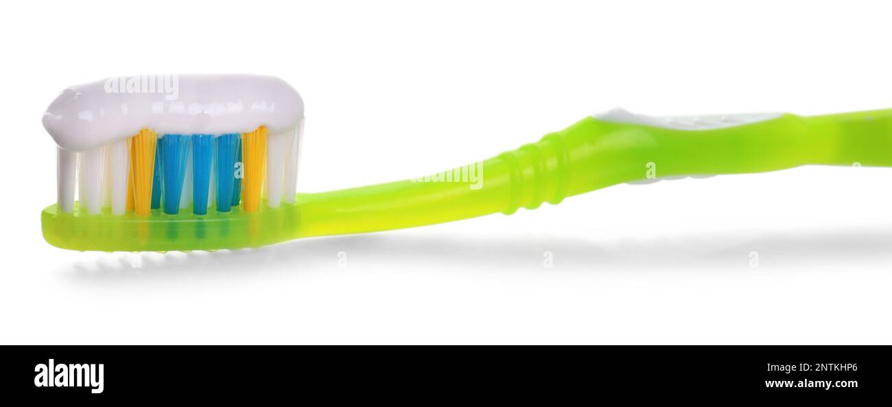 Green brush with toothpaste isolated on white Stock Photo - Alamy