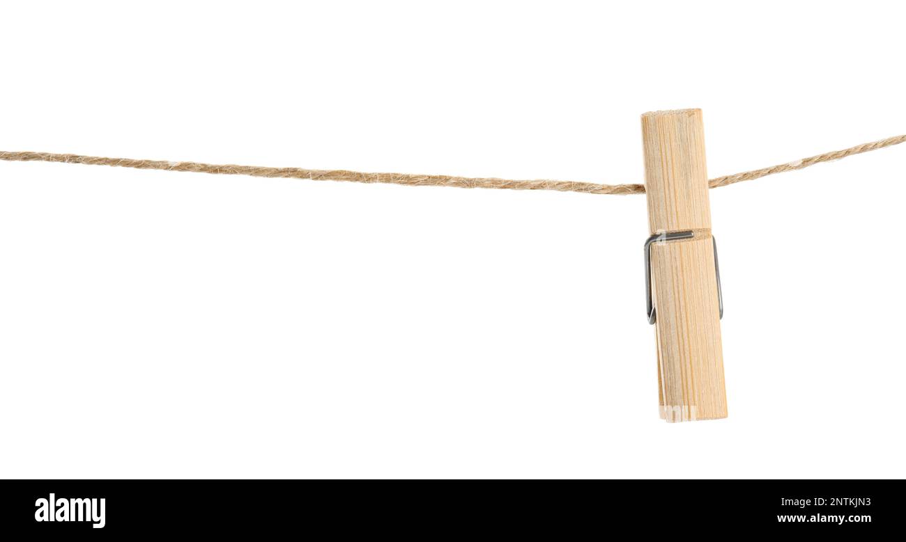 Wooden clothespin on rope against white background Stock Photo Alamy