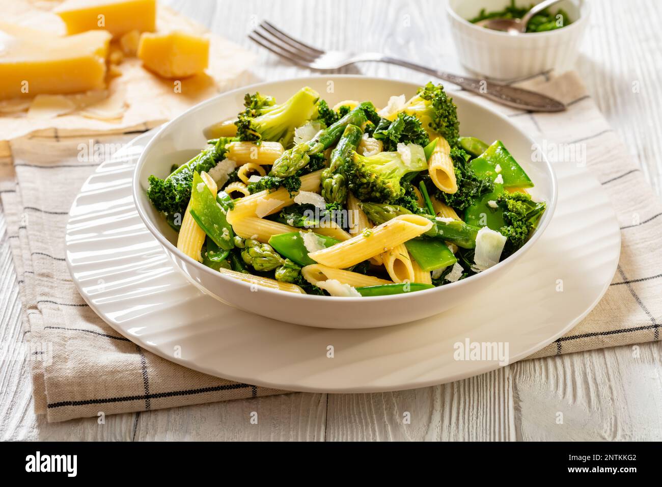 Pasta penne primavera with asparagus, snap peas, broccoli and kale in ... Pasta penne primavera with asparagus, snap peas, broccoli and kale in ...