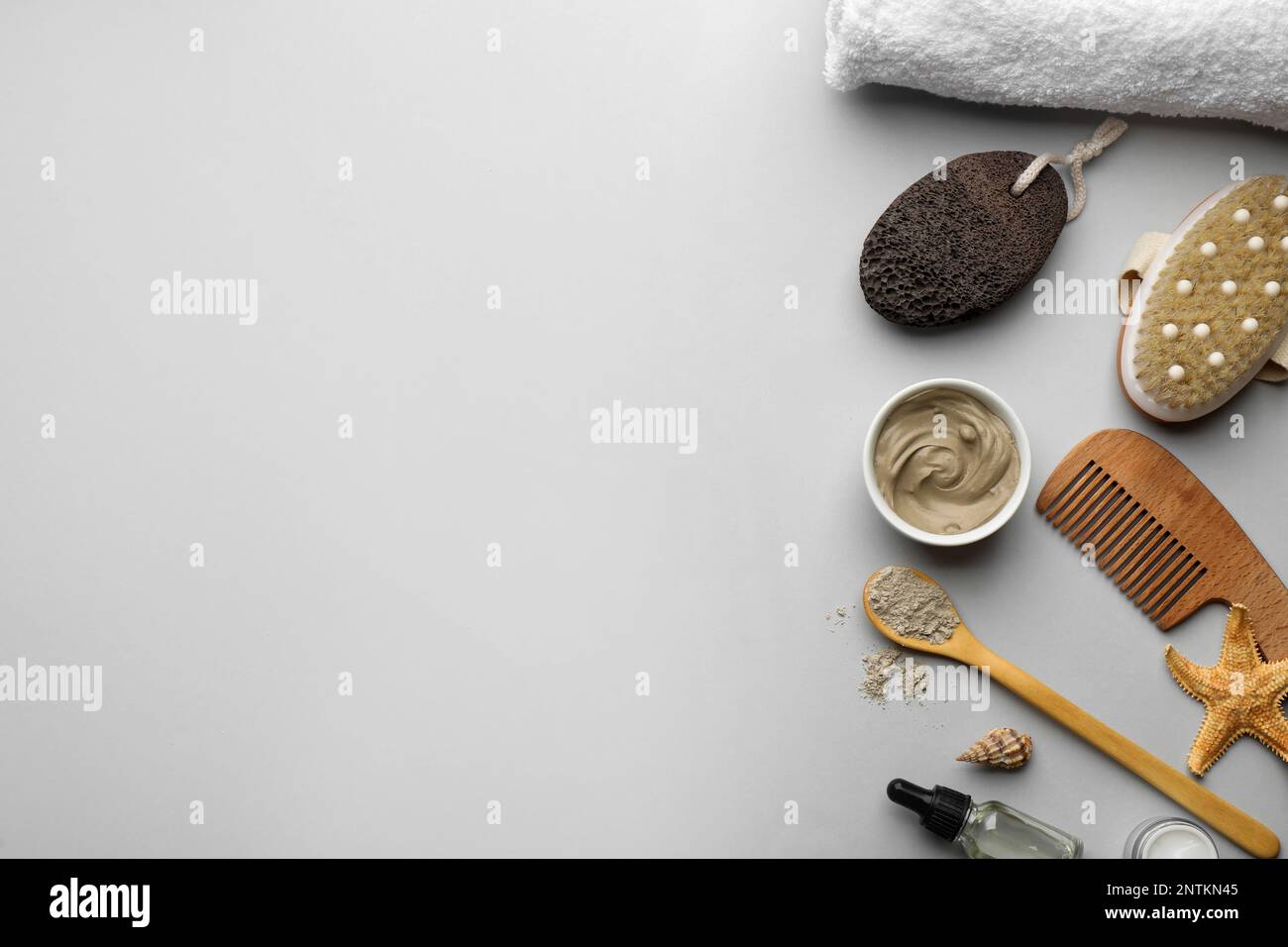 Flat lay composition with pumice stone on light grey background. Space ...